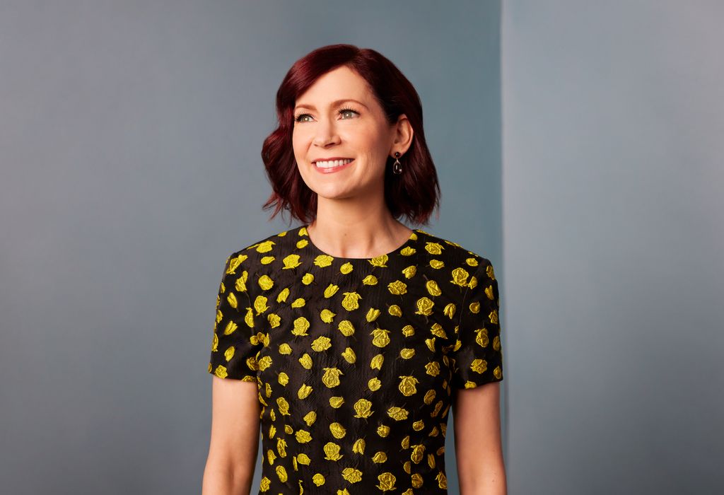 Carrie Preston stands in front of a lilac wall
