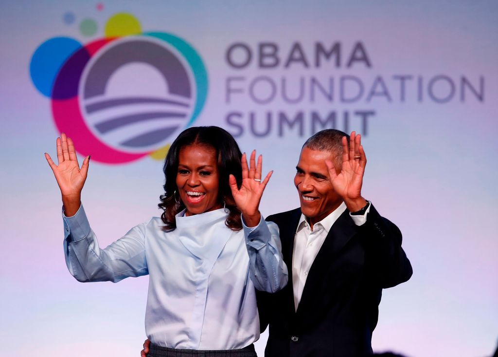 Former US President Barack Obama and his wife Michelle arrive at the Obama Foundation Summit in 2017