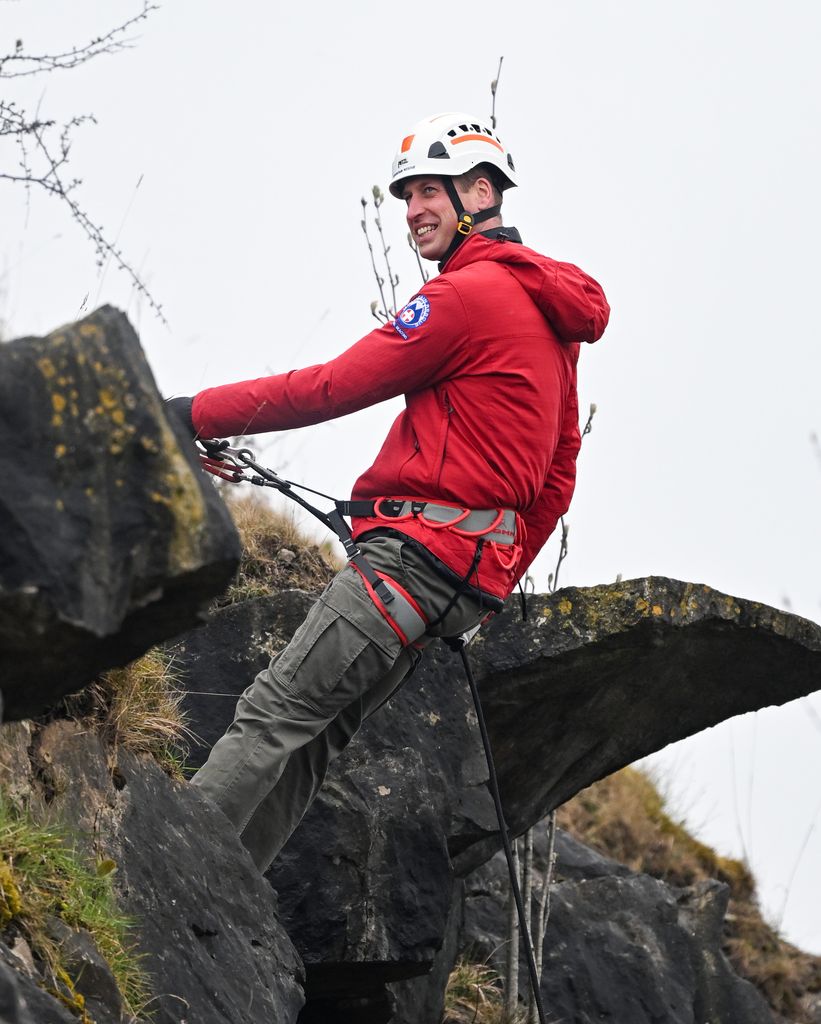William smiling while abseiling