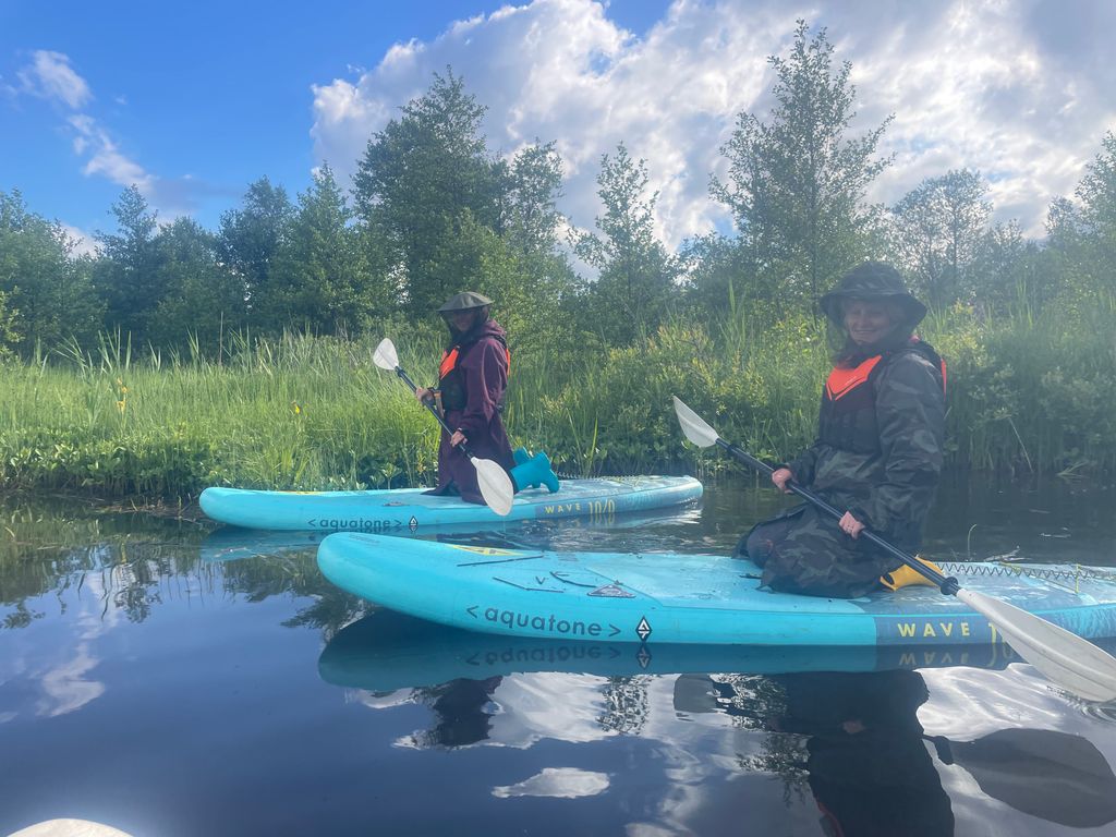 Getting involved in the paddle boarding along the river