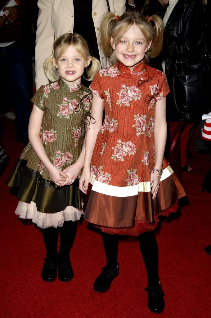 Dakota Fanning and sister Elle during "The Cat In The Hat" World Premiere at Universal Studios Cinema in Universal City, California, 2003
