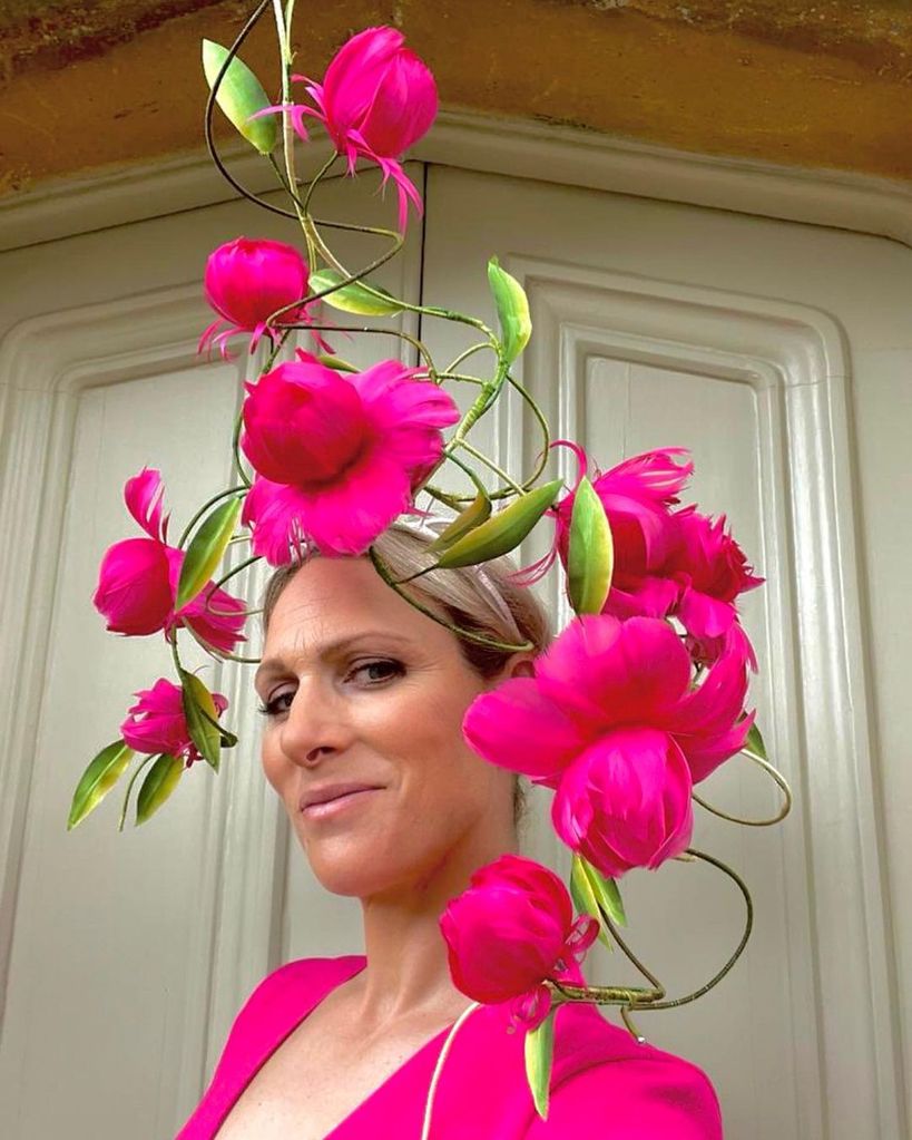 Zara Tindall wears a pink floral headpiece and wears a pink puff-sleeved dress