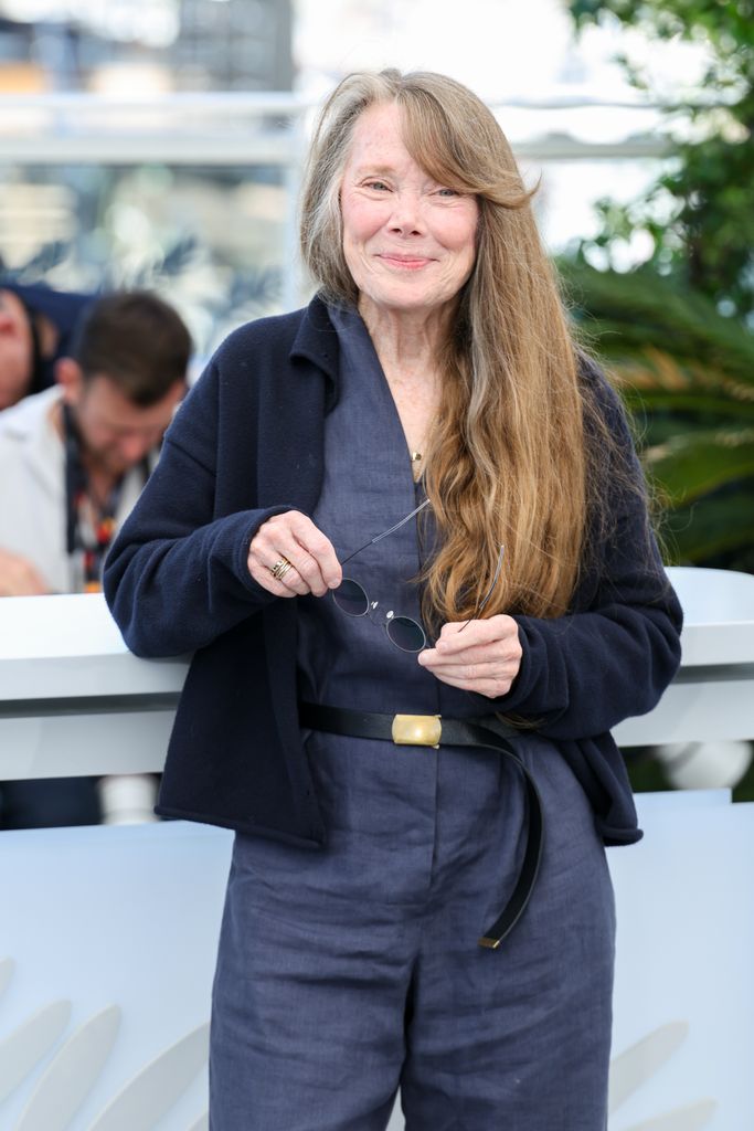 Sissy Spacek in gray jumpsuit posing during the Die My Love photocall at the 78th annual Cannes Film Festival )