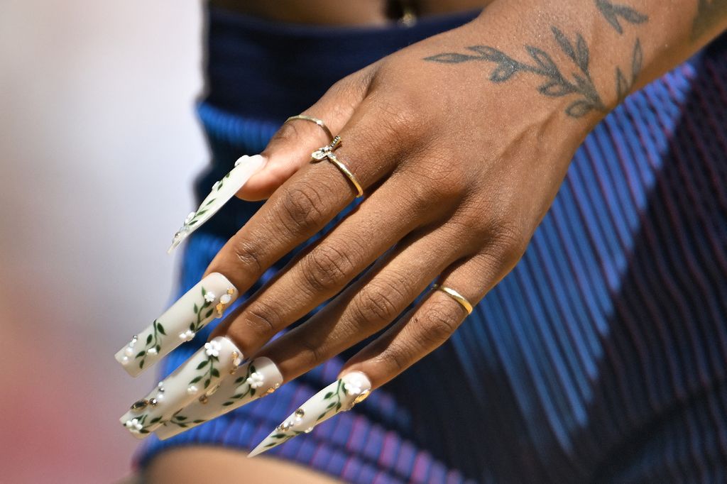 The nails of USA's Sha'Carri Richardson are seen after the women's 200m heats during the World Athletics Championships at the National Athletics Centre in Budapest on August 23, 2023