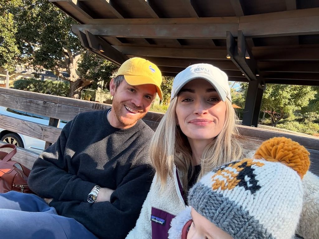 Smiling with caps at a farm
