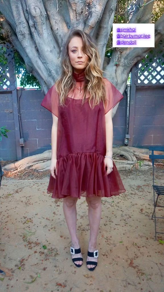 Kaley Cuoco in a burgundy mini dress and jewelled heels