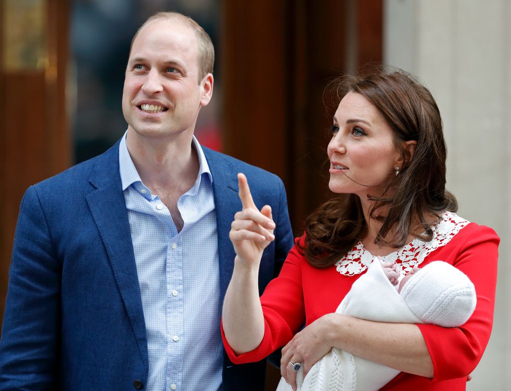 William standing next to Kate who is holding newborn baby Louis outside Lindo Wing in April 2018