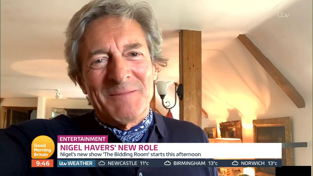 Nigel Havers standing on the top floor of his home