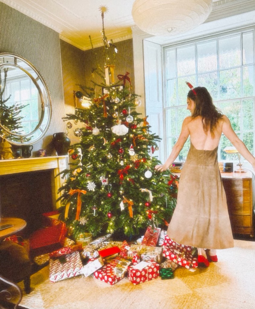 lily james in suede backless dress