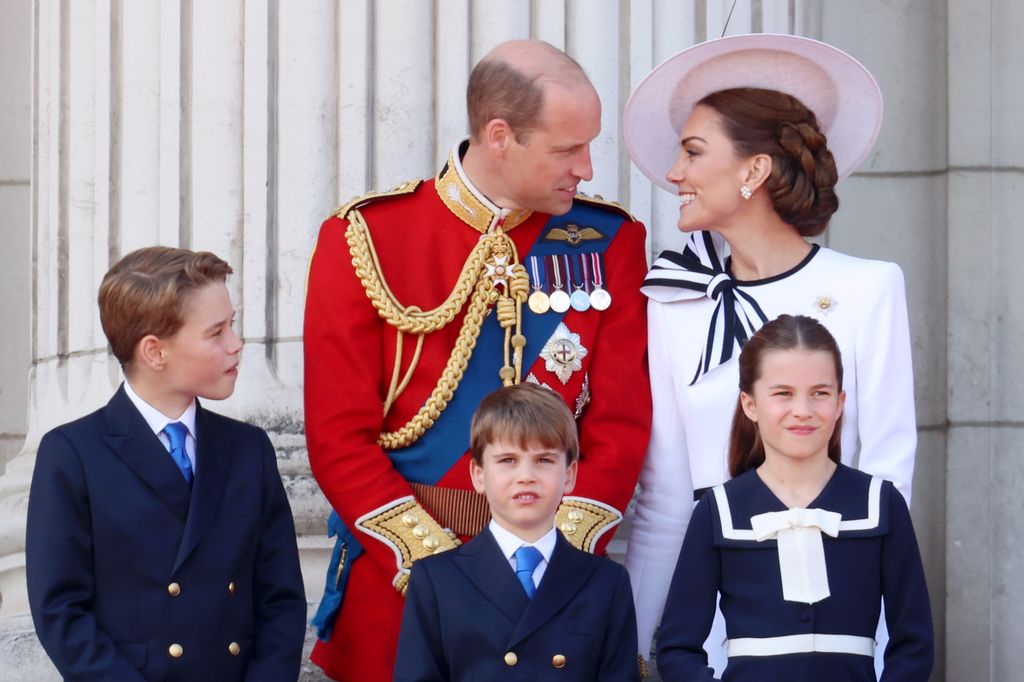 Prince William and Kate Middleton looking at each other - they're joined by Prince George, Prince Louis and Princess Charlotte