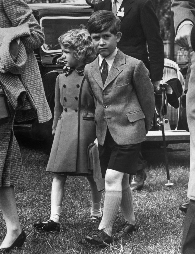 Then-Prince Charles and Princess Anne walking at the Windsor castle in 1958