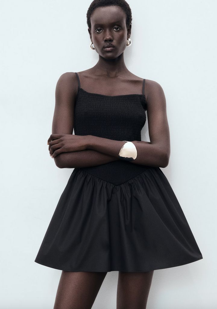 Mango model wearing a black mini dress