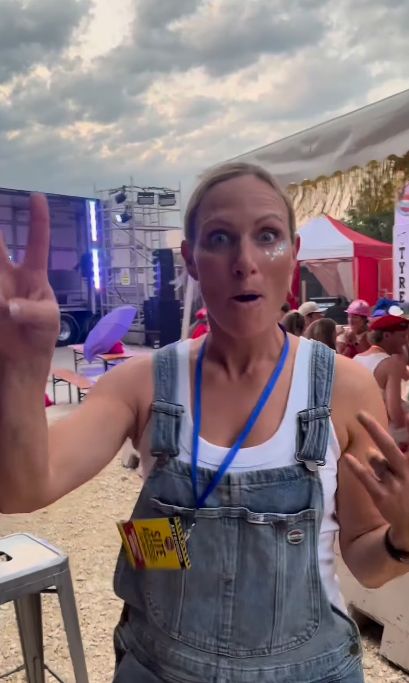 Zara Tindall in blue dungarees and a white top