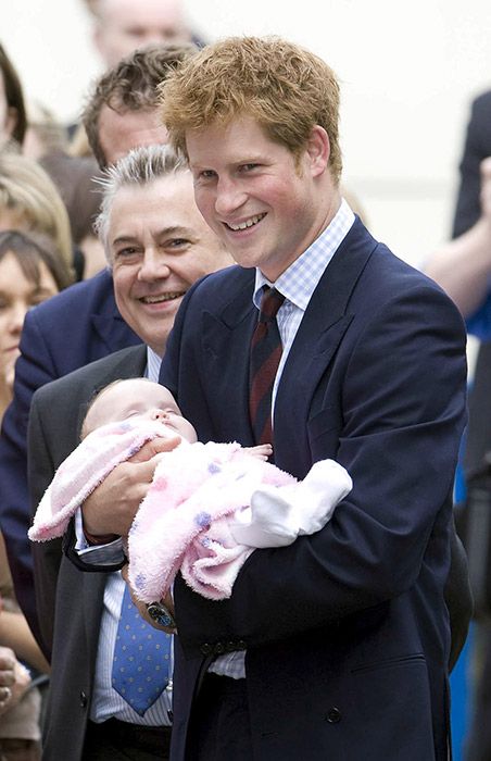 prince harry holding baby