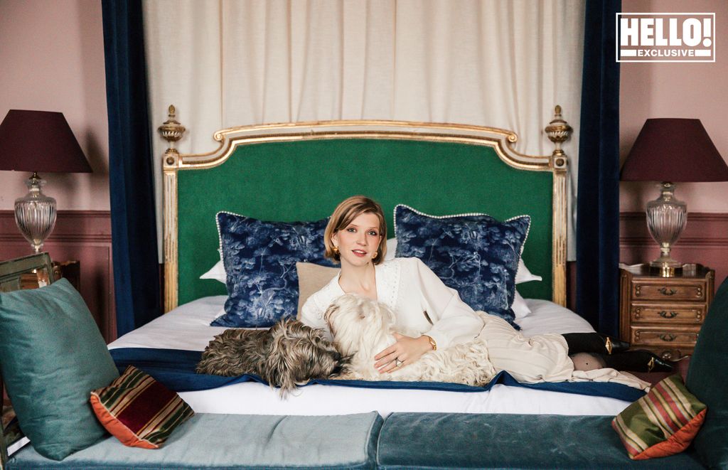 Catherine Roger posing on bed at Chateau Marcellus near Bordeaux