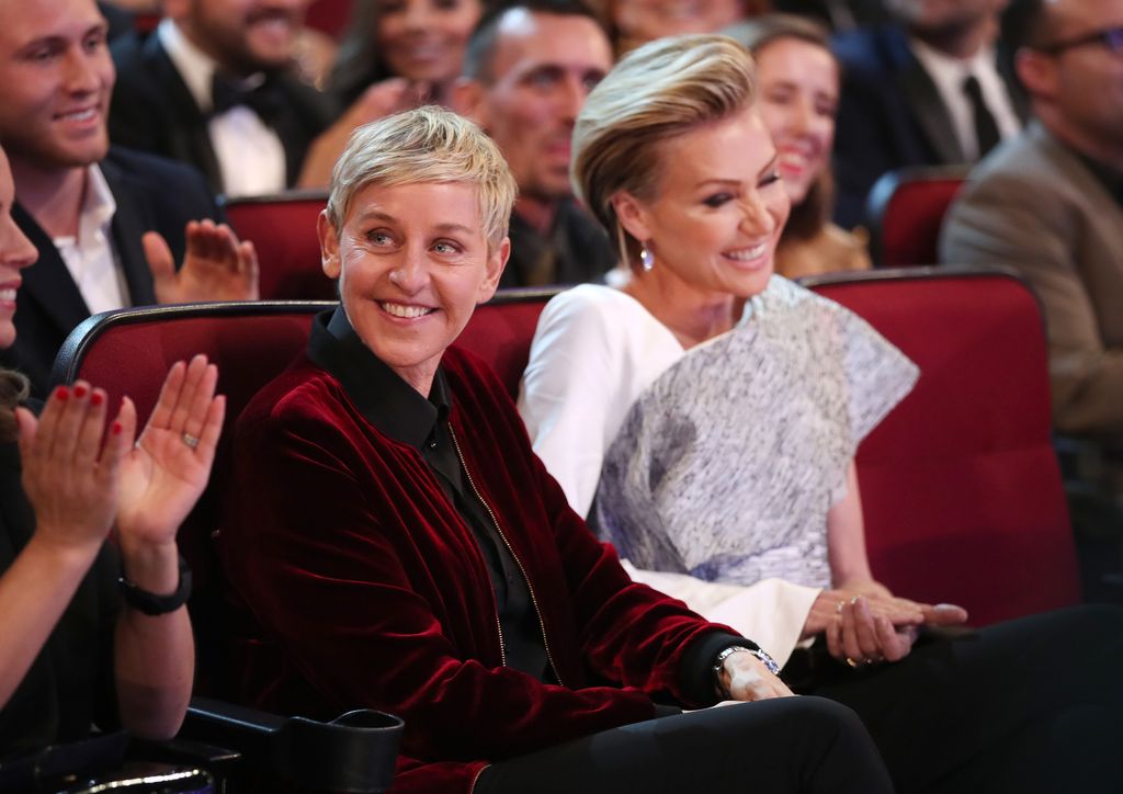 TV personality Ellen DeGeneres (L) and actress Portia de Rossi sat next together laughing at he People's Choice Awards 2017