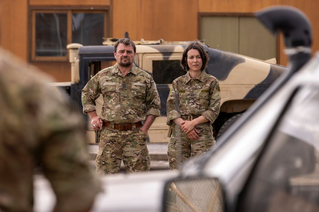 man and woman in military kit
