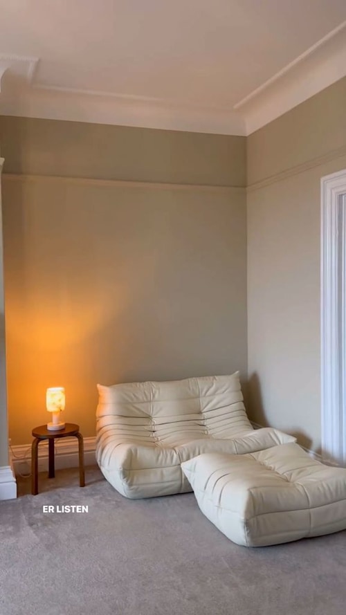 bedroom with cream leather seating 