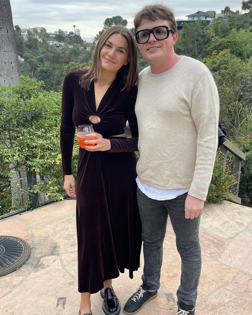 Sam Michael Fox and Molly Milstein pose for a photo at an event, shared on Instagram