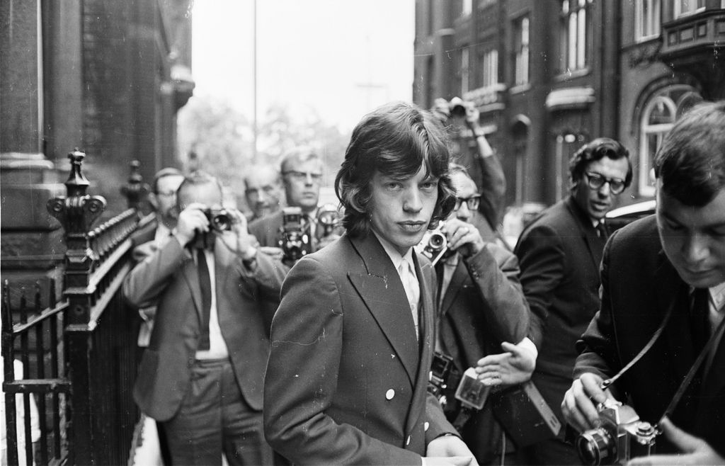  Surrounded by press photographers, Mick Jagger arrives at the London law courts to appeal against his conviction on drug charges on 31st July 1967
