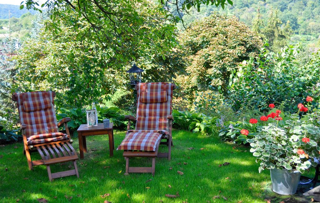 two sun loungers in beautiful garden