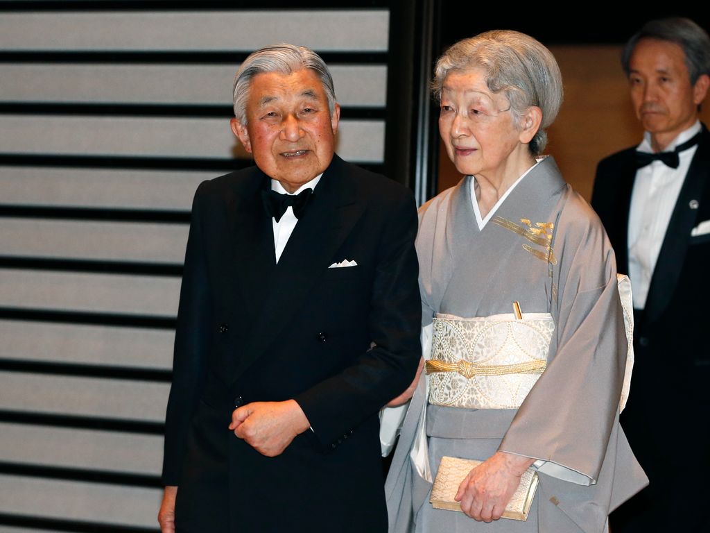 Japan's Emperor Akihito and Empress Michiko wait for the arrival 
