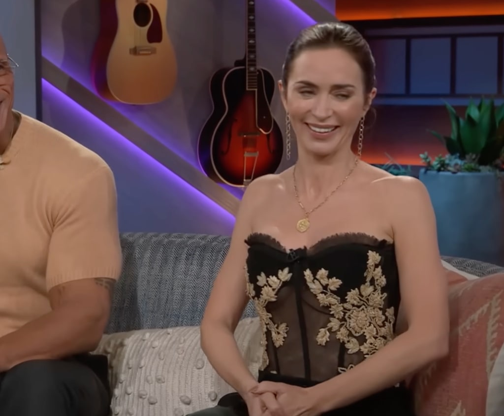 Emily Blunt in black sheer corset top