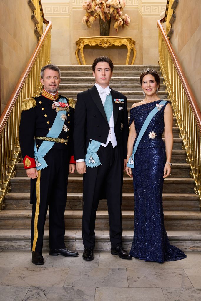 Prince Christian poses with Crown Prince Frederik and Crown Princess Mary