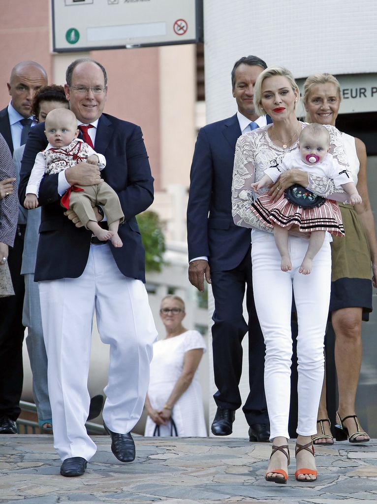 albert and charlene holding babies Prince Jacques and Princess Gabriella 