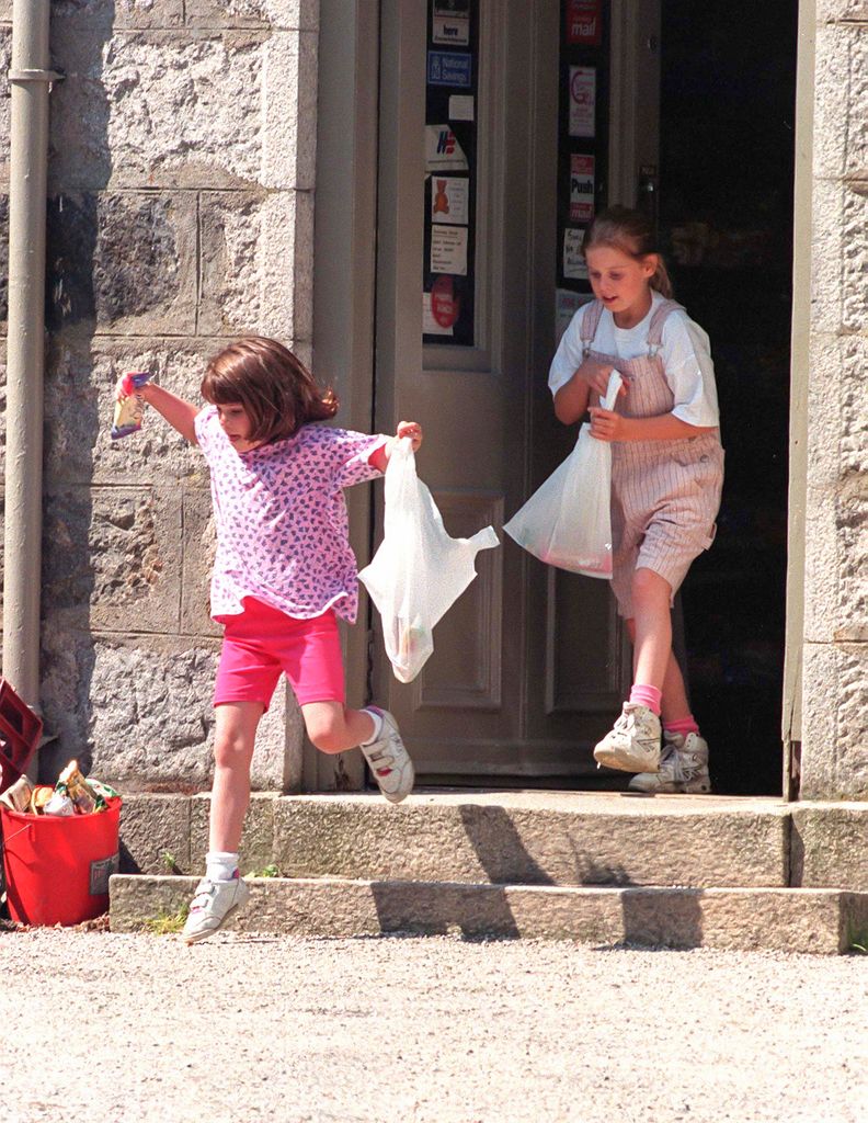 The Duchess of York, takes her children, Princess Beatrice, and Princess Eugenie to the post office, at Balmoral Estate on May 31 1997, in Balmoral, Scotland.