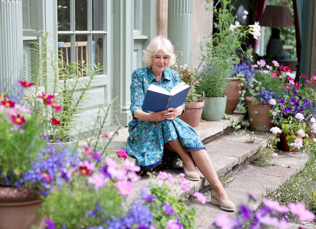 Queen Camilla reading a book