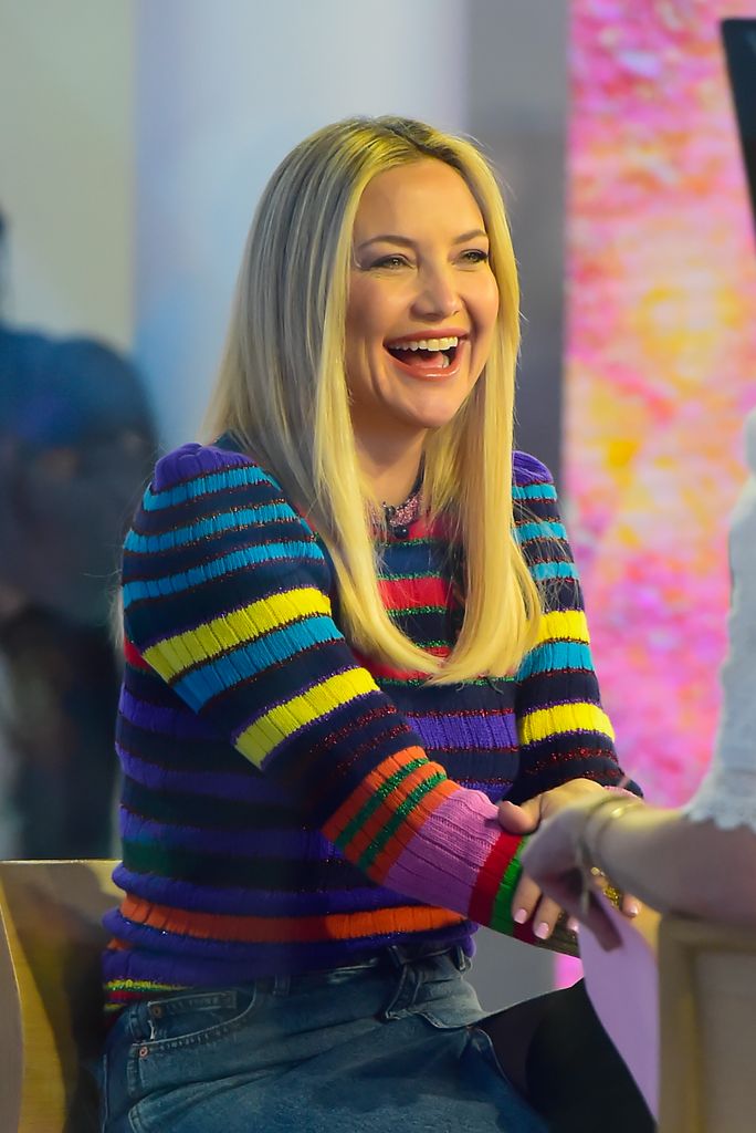 Kate smiling in stripe sweater