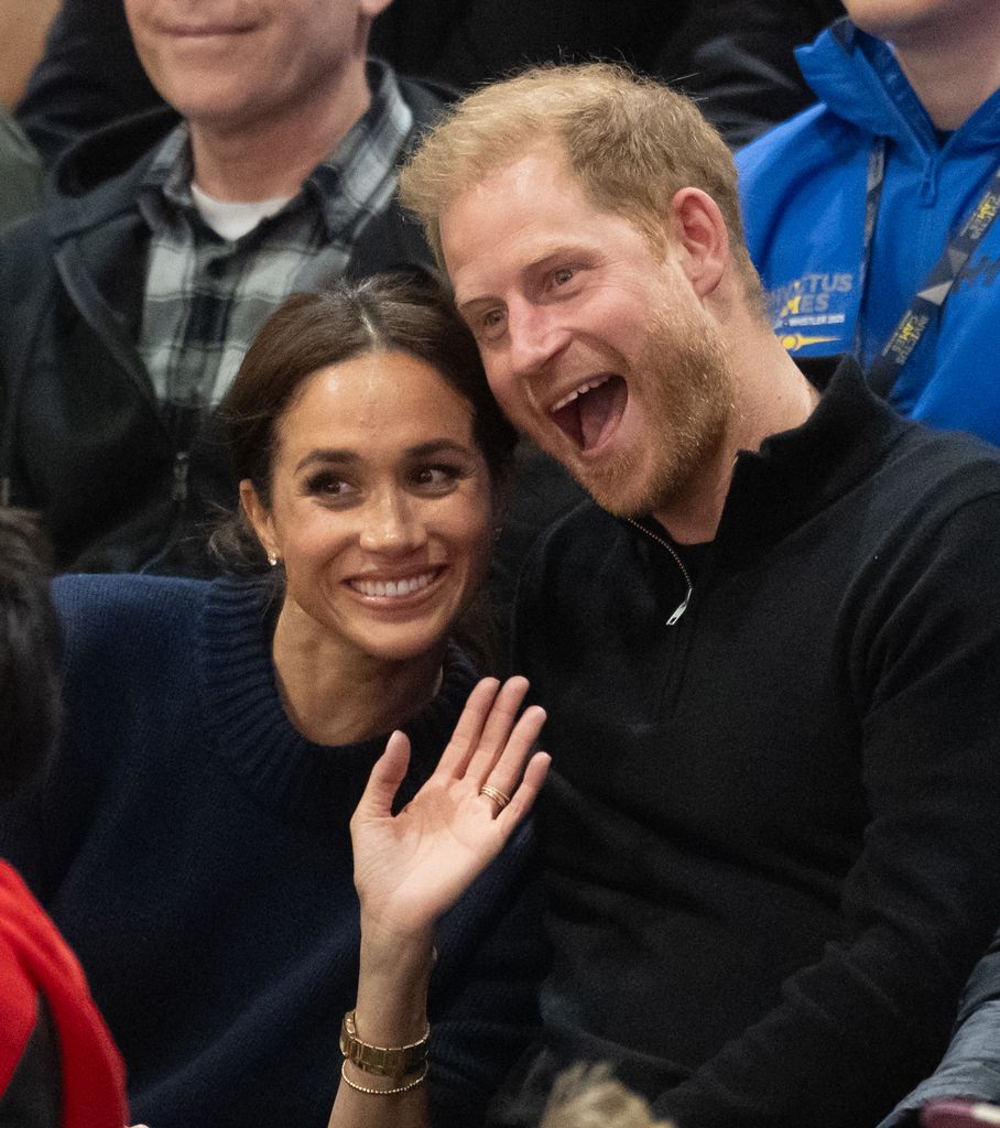 Prince Harry and Meghan pose for a photo as they attend the Wheelchair Basketball final between USA and Israel
