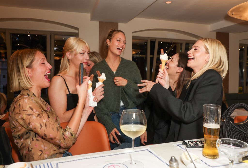 Princess Olympia laughing with Alexia Mavroleon, Jessica Clarke, Emilia Wickstead and Poppy Delevingne