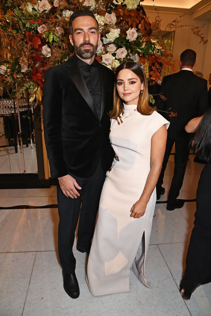 Jamie Childs standing with Jenna Coleman in a white dress