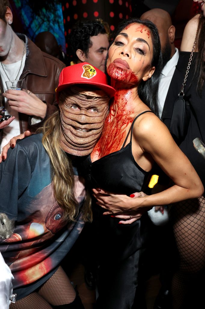 Heidi Klum in mask and Nicole Scherzinger with blood on face