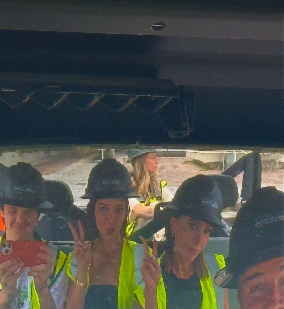 beckhams wearing high-vis jackets and hard hats