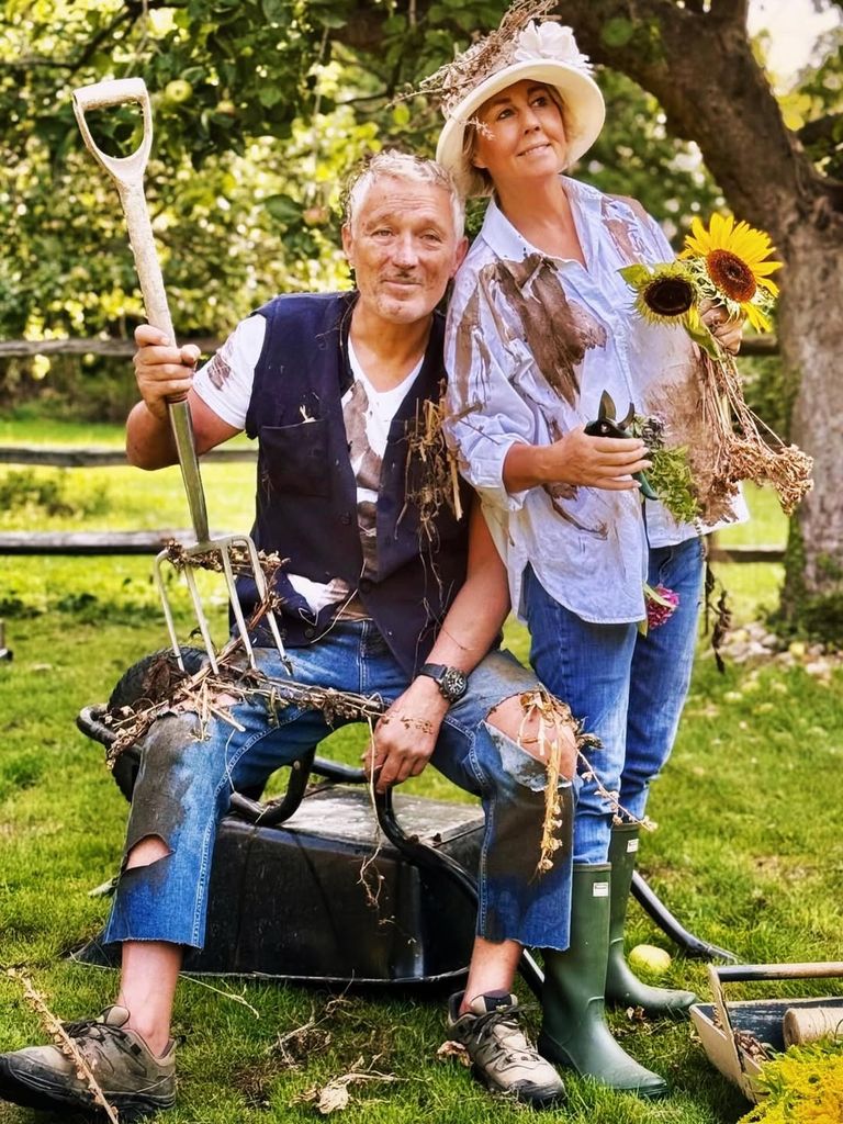 Martin and Shirlie Kemp in the garden covered in mud