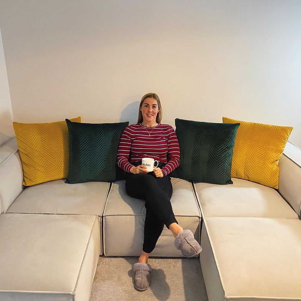 Mary Earps posed on her brand new sofa