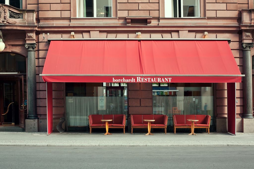 Borchardt restaurant in Berlin exterior view with red awnings 