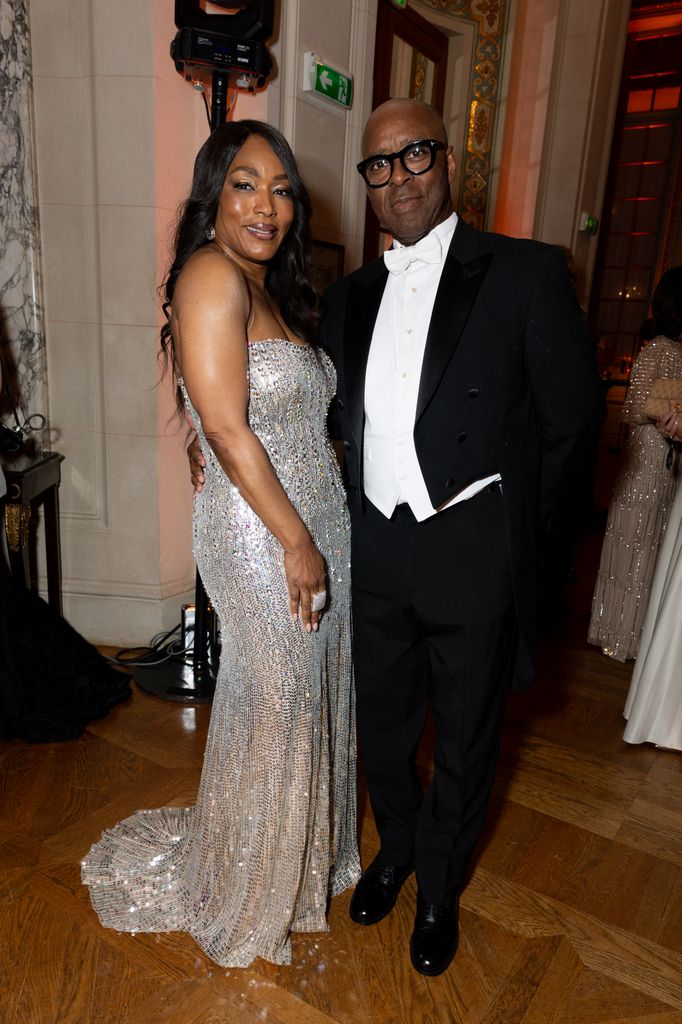Angela Bassett in silver dress and Courtney B. Vance in white tie
