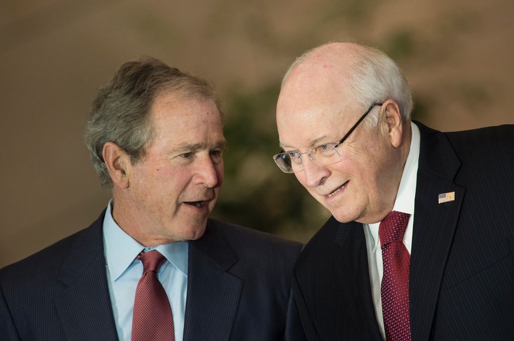 Former US President George W. Bush and former Vice President Dick Cheney  talk on December 3, 2015, during a dedication ceremony hosted by the US Senate at Emancipation Hall