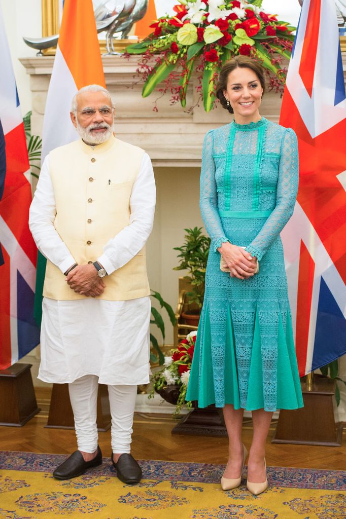 Catherine with Prime Minister of India in blue lace dress