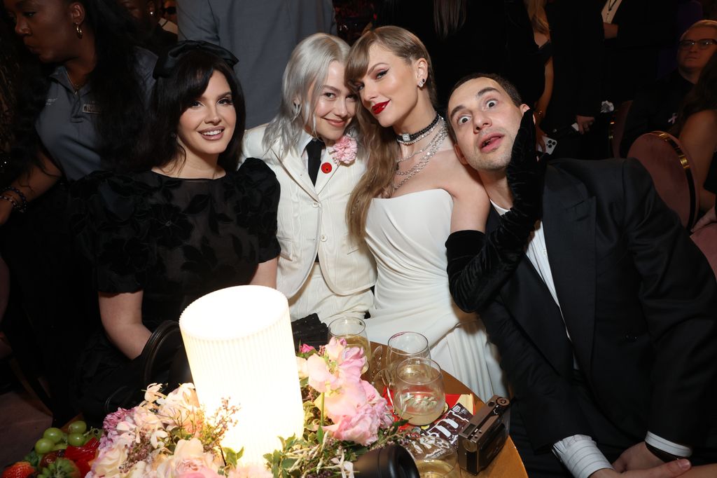 Lana Del Ray, Phoebe Bridgers, Taylor Swift and Jack Antonoff we seated at a charcuterie table