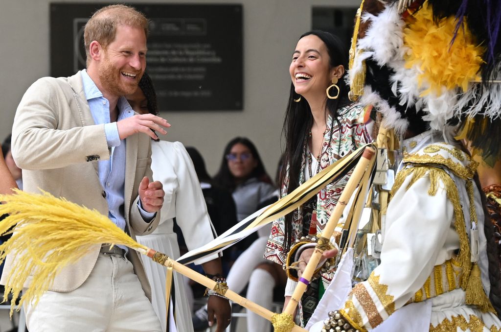 Prince Harry dancing with dancer at arts centre