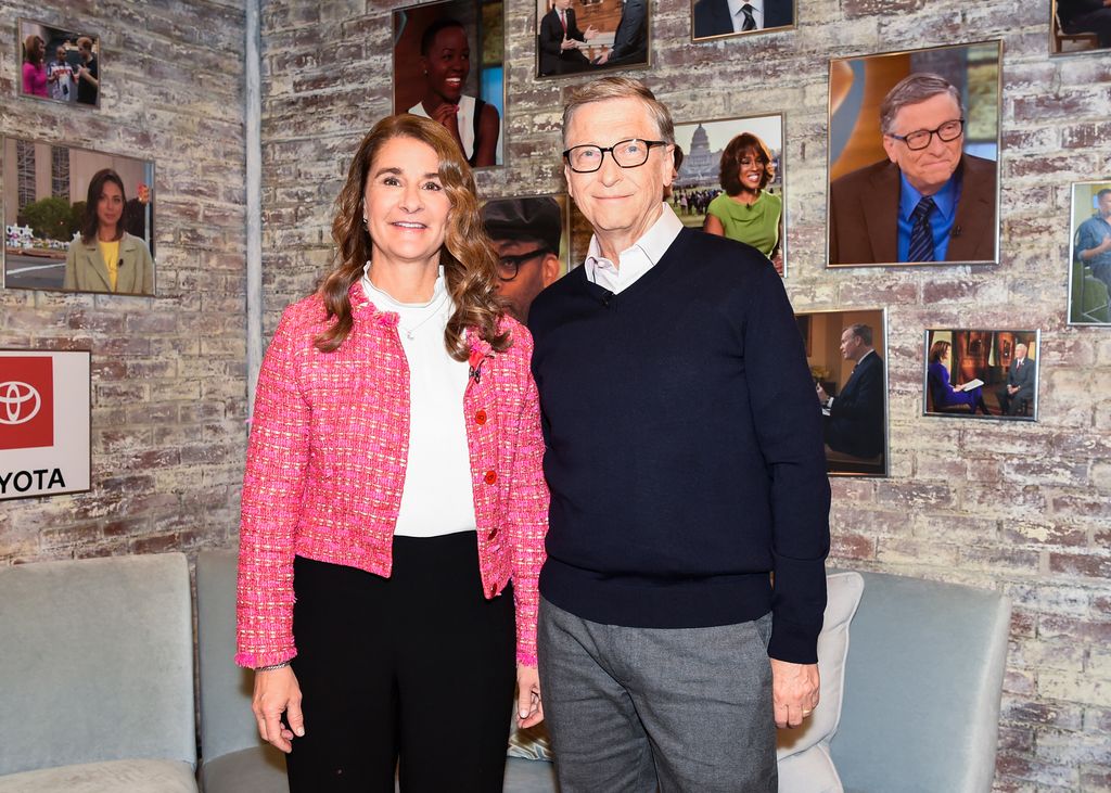 Bill and Melinda Gates smiling for a photo in a TV studio