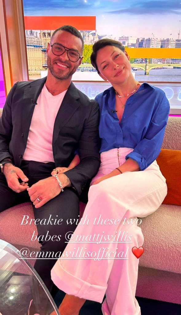Emma Willis and Matt Willis sit next to each other with arms linked