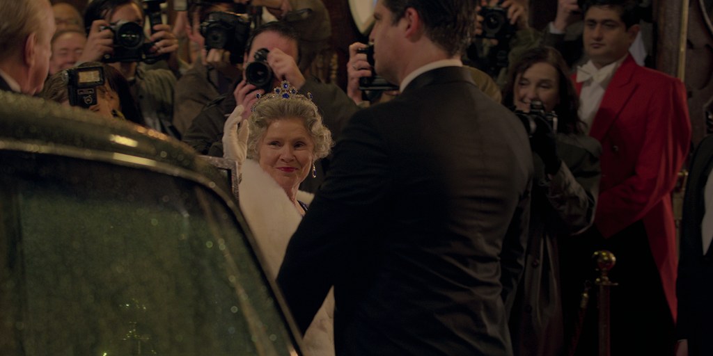 Imelda Staunton as Queen Elizabeth II steps out of car in The Crown