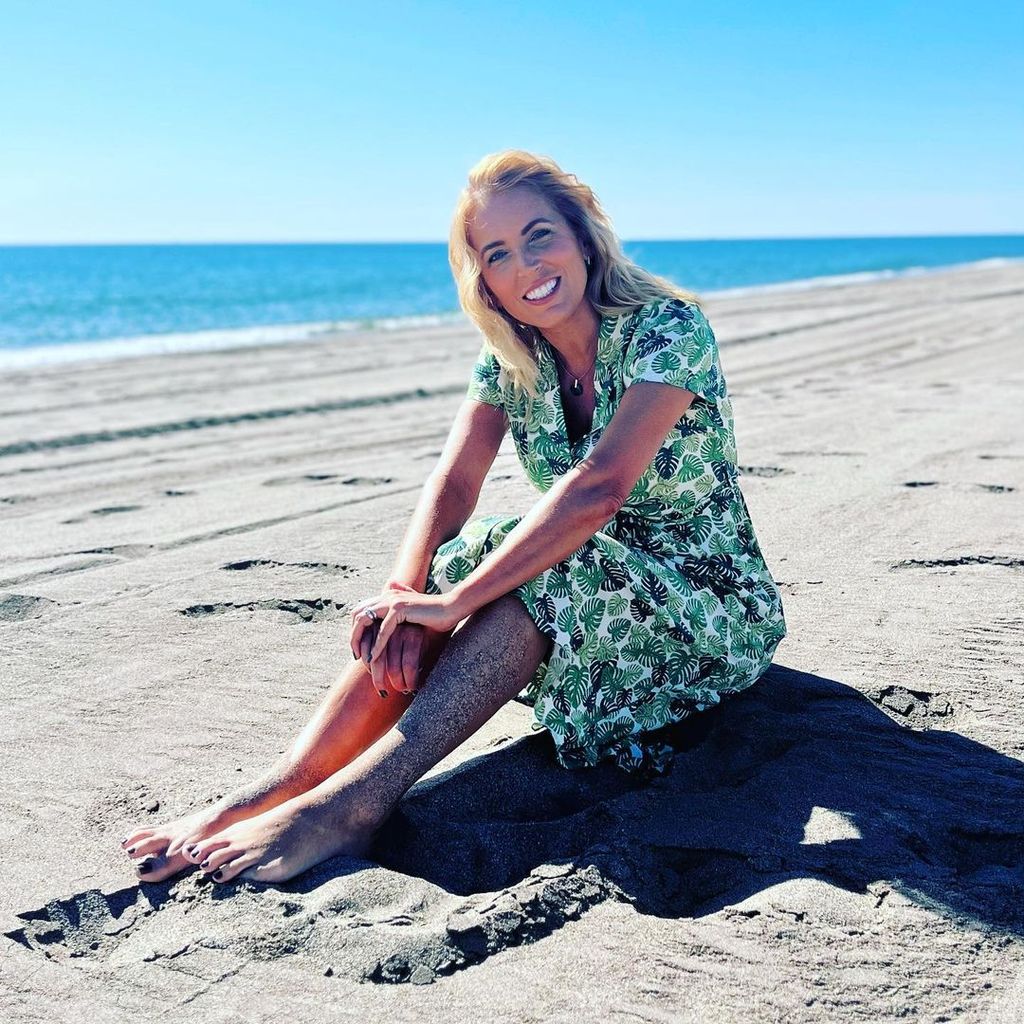 Jasmine Harman poses on the beach behind-the-scenes of A Place in the Sun