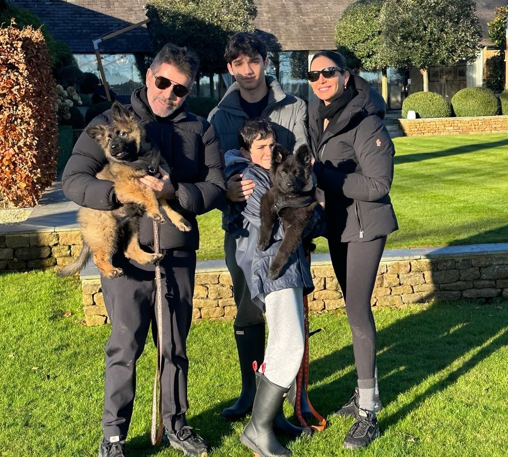 Simon Cowell with Lauren Silverman, her son and Adam and Eric Cowell in their manicured garden